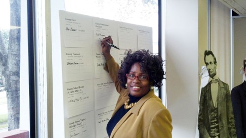 Glorice McPherson signs the board at the Harris County Republican Party headquarters.