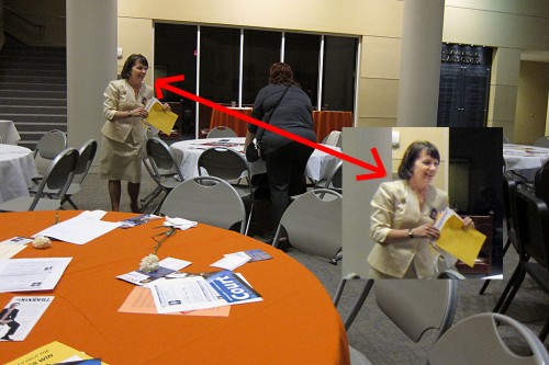 Judge Denise Pratt picking up negative flyers at the HCRP Executive Meeting.